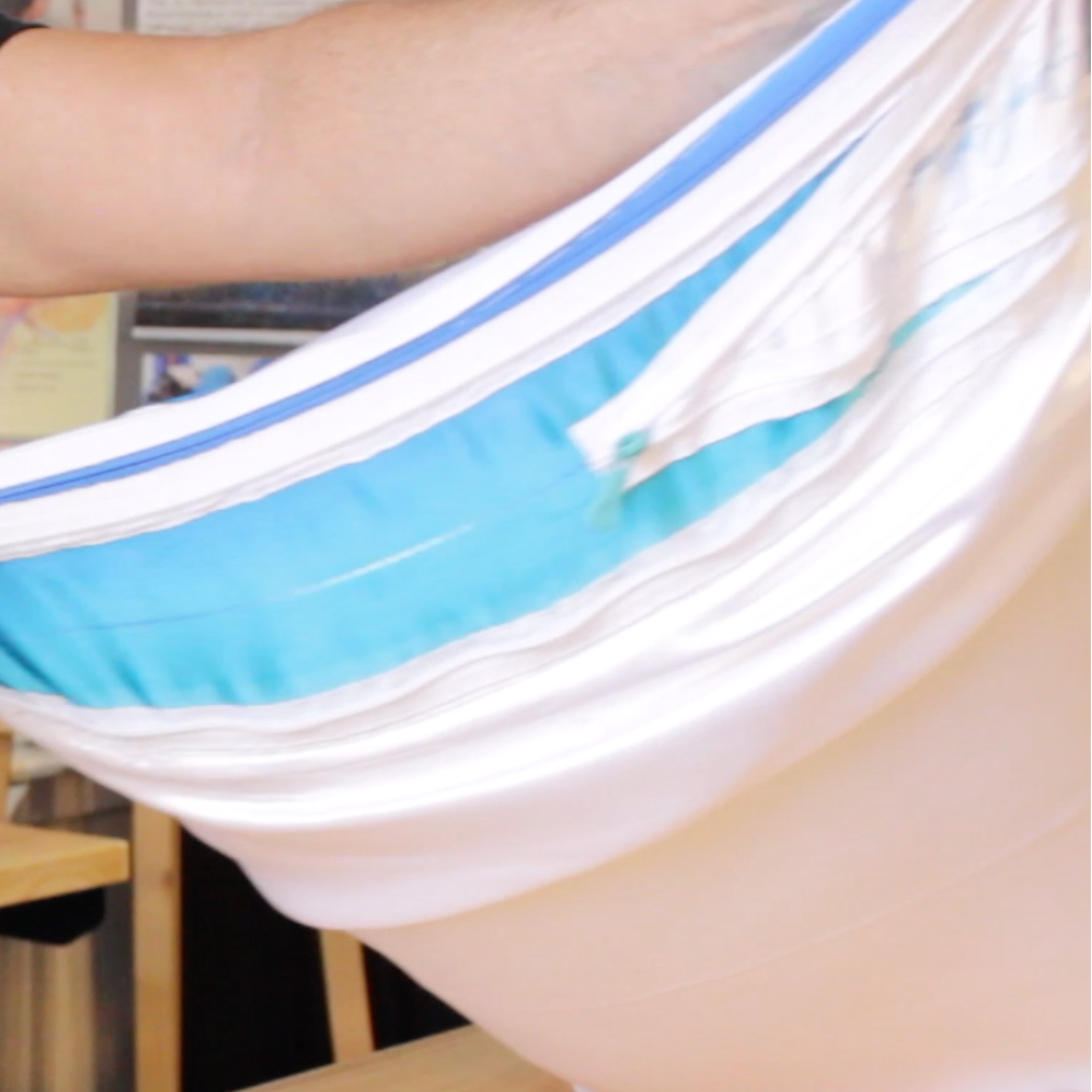 Spiral adjusting zipper system close-up on satin PillowWare Casing 